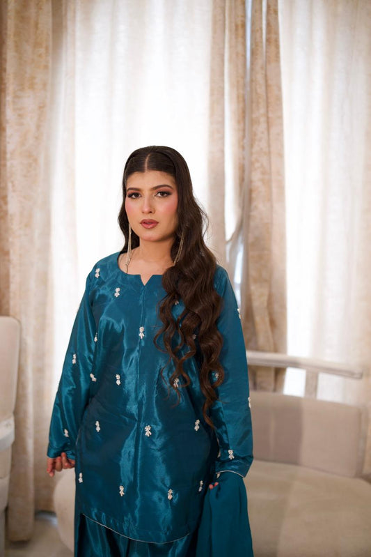 Making them green with envy in this teal silk.