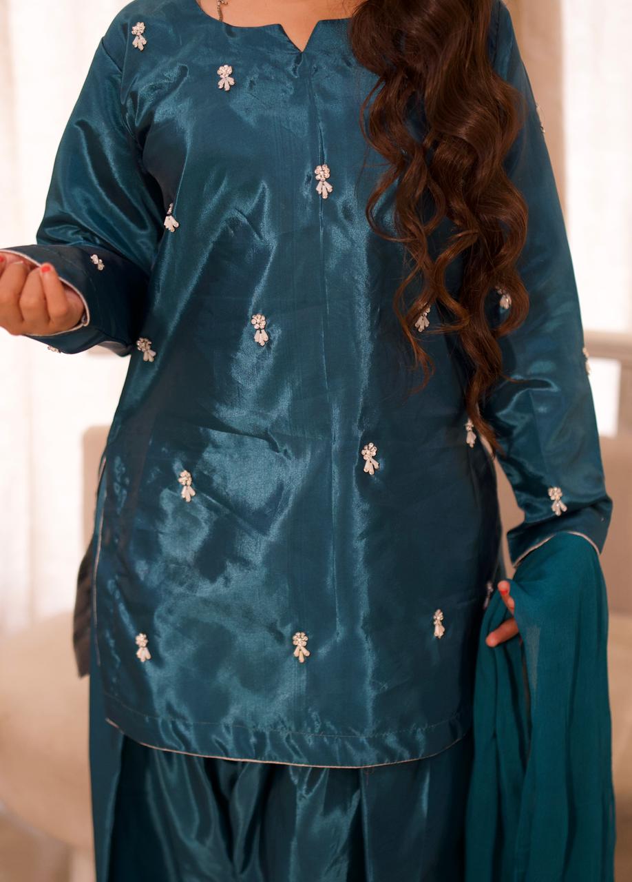 Making them green with envy in this teal silk.