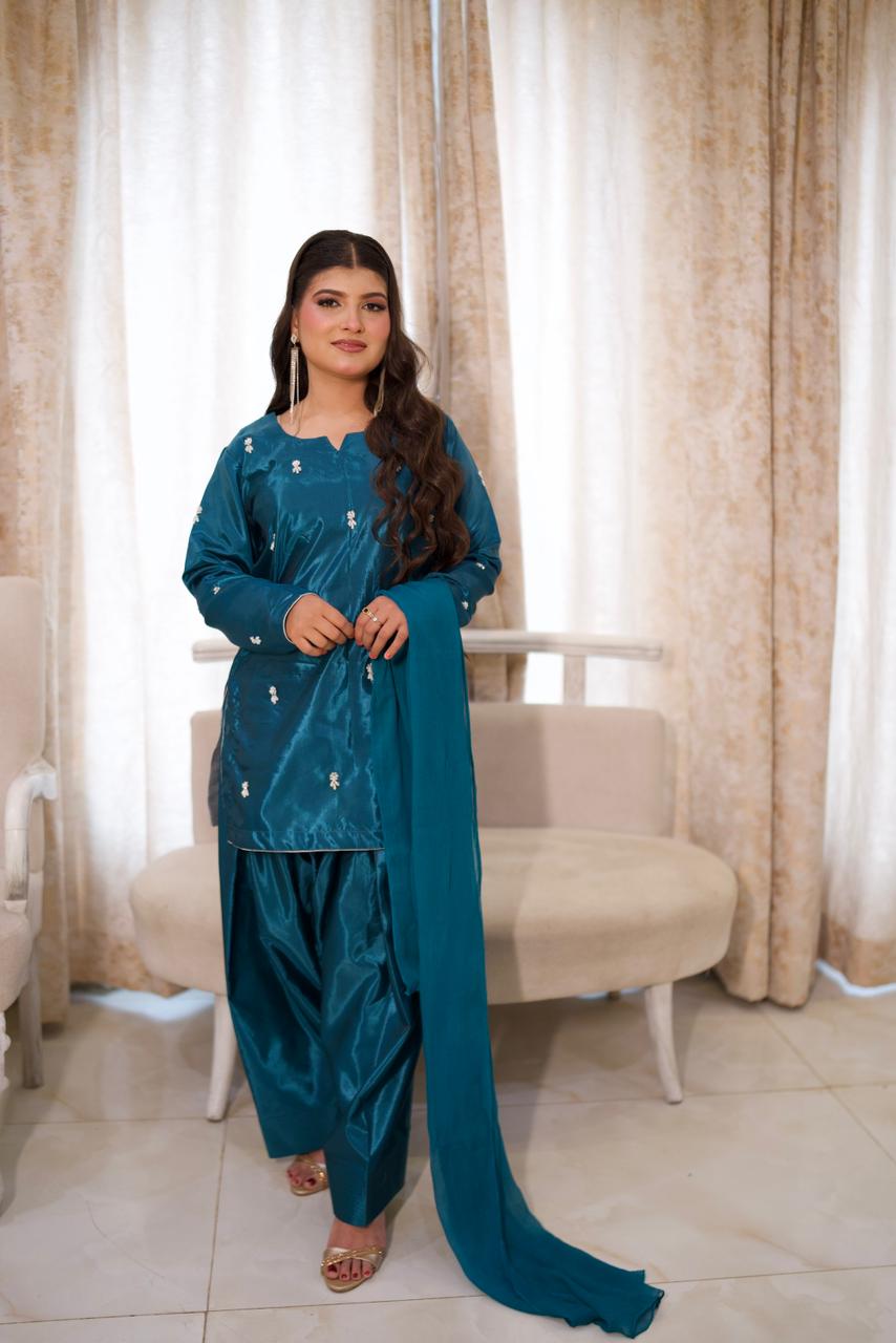 Making them green with envy in this teal silk.