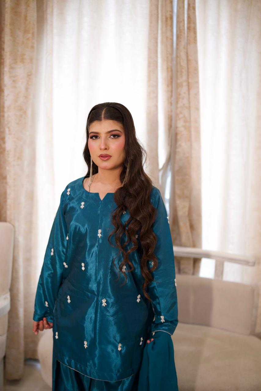 Making them green with envy in this teal silk.