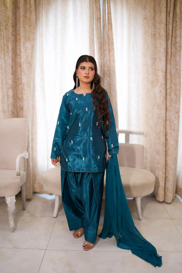 Making them green with envy in this teal silk.