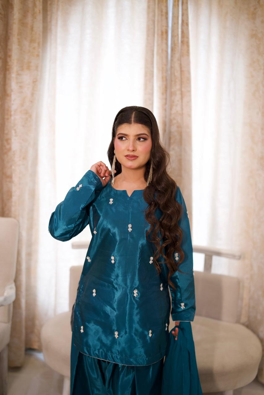 Making them green with envy in this teal silk.